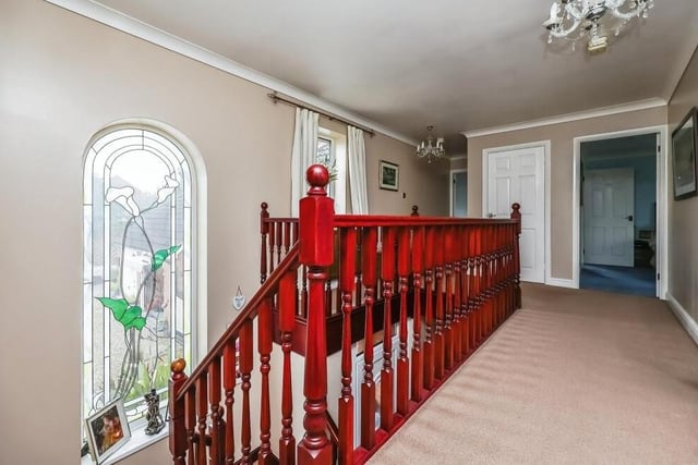 At the top of the stairs, you are greeted by this lovely galleried landing on the first floor of the £600,000-plus property. It has a feature arched window facing the front of the house, carpeted flooring, an airing cupboard, storage cupboard, coving to the ceiling and access to roof space.