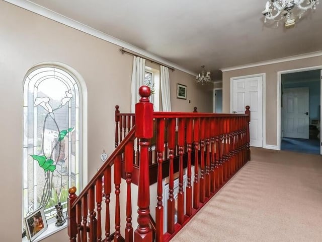 At the top of the stairs, you are greeted by this lovely galleried landing on the first floor of the £600,000-plus property. It has a feature arched window facing the front of the house, carpeted flooring, an airing cupboard, storage cupboard, coving to the ceiling and access to roof space.