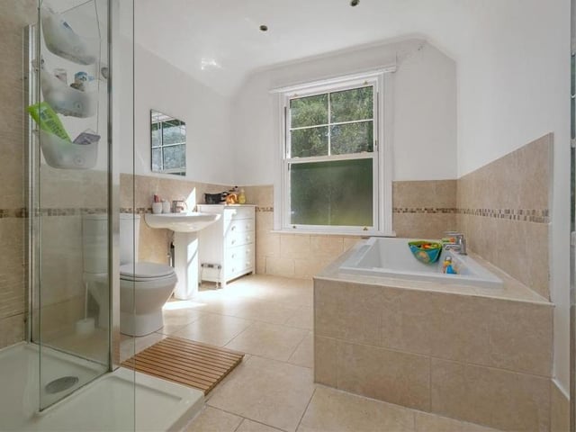 The en suite bathroom to the master bedroom is luxurious to say the least. It's a four-piece suite with chrome fittings, tiled walls and ceiling spotlights.