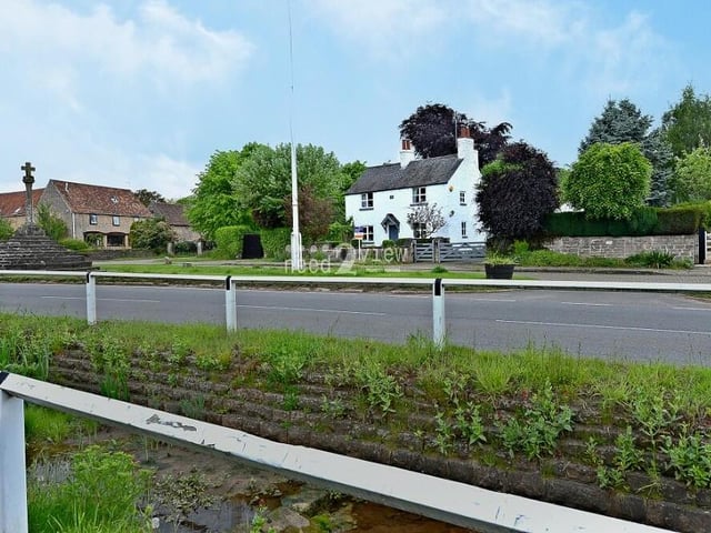 This view from the other side of Main Street underlines that Cosy Cottage is the standout property.