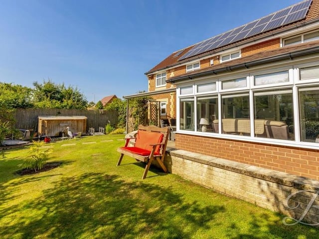 As you look at the back garden from a different angle, you can see that the property benefits from solar panels. Very handy on a day like this.