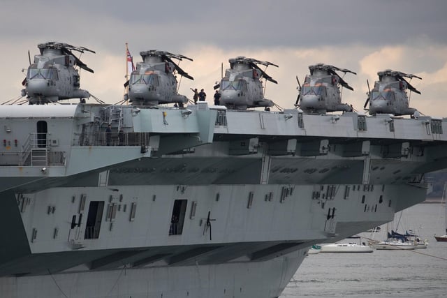 Merlin helicopters on the flight deck of the Royal Navy aircraft carrier HMS Queen Elizabeth. Picture: Andrew Matthews/PA Wire