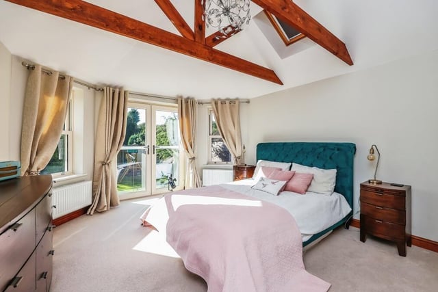 Time to go upstairs now to check out the four bedrooms, starting with the master. Its prize assets are the beamed ceiling and the doors opening out on to a Juliet balcony, which offers breathtaking views of the back garden and the countryside beyond.