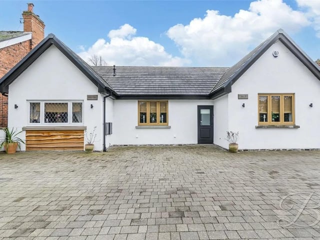 The front of the property is enclosed by a secure wall, providing both privacy and access to the block-paved driveway, offering ample off-street parking.
