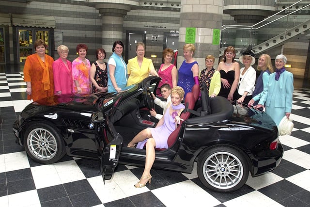 A fashion show in aid of the Life After Breast Cancer Support Group was held in 2001. Our picture shows Ann Johnson, and Robert Bennie, aged 17, in the sporty BMW car, surrounded by some of the other models.