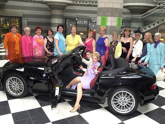 A fashion show in aid of the Life After Breast Cancer Support Group was held in 2001. Our picture shows Ann Johnson, and Robert Bennie, aged 17, in the sporty BMW car, surrounded by some of the other models.