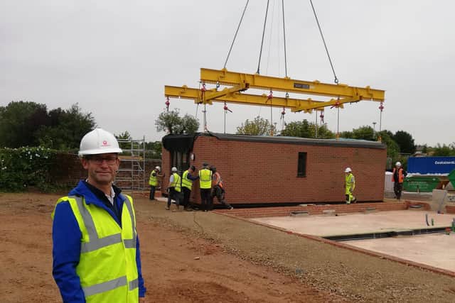 Executive Mayor Andy Abrahams onsite as the first modular homes are constructed.