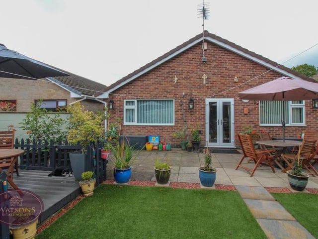 One last look at the Eastwood property from the back garden. You can see a decked seating area to the left and the French doors that lead out from the third bedroom or office.