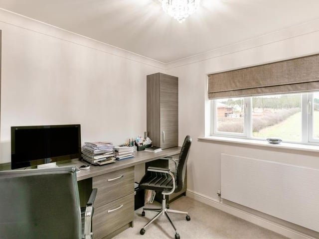 As you can see, the fourth bedroom can be converted into an office if you need to work from home. But it is blessed with two sets of fitted wardrobes, while the window faces the back of the £635,000 property.