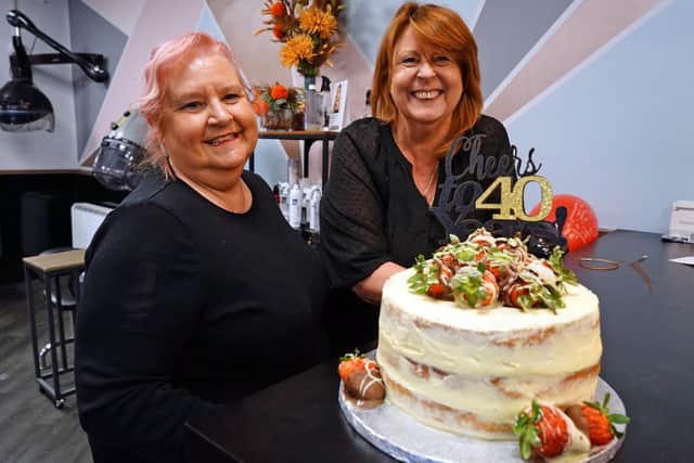 Best friends Jackie Coope (left) and Jane Williamson celebrate 40 years at the Friends Hair Company Salon.
