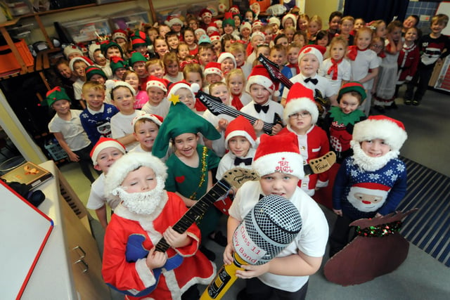 Grange Primary School pupils wearing Christmas jumpers and different costumes six years ago.