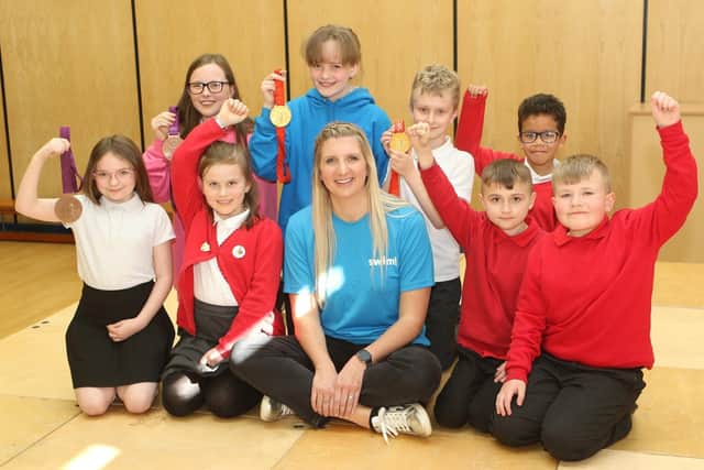 Children at Crescent Primary School in Mansfield meet the town's gold medal-winning Olympic swimmer Rebecca Adlington.