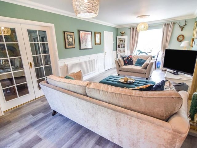 A second shot of the lounge which, like the rest of the house, is immaculately presented. Wooden shutters lead to another of the reception rooms.
