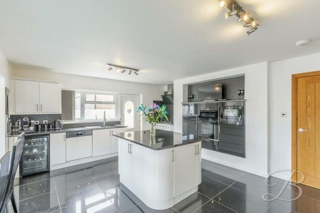 A second shot of the kitchen/'diner, which is the perfect spot to showcase your cooking skills. Integrated appliances include a double oven, microwave, dishwasher, extractor fan and gas hob, while an inset sink has a mixer tap above.