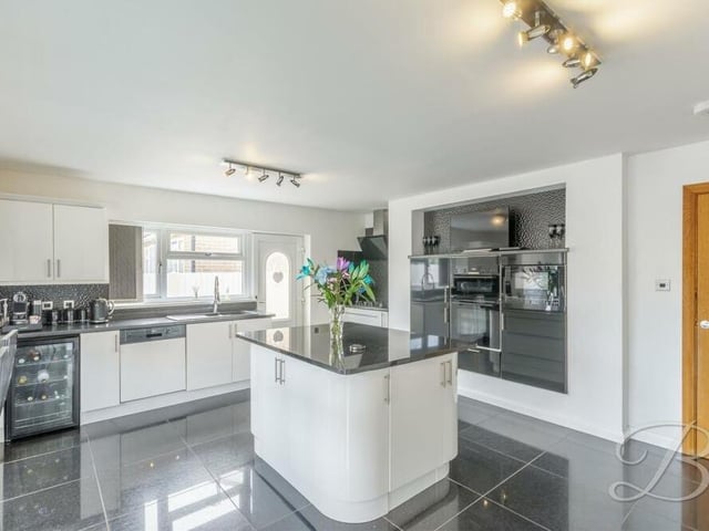A second shot of the kitchen/'diner, which is the perfect spot to showcase your cooking skills. Integrated appliances include a double oven, microwave, dishwasher, extractor fan and gas hob, while an inset sink has a mixer tap above.