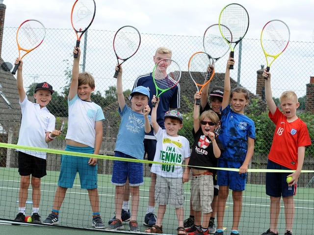 Coach Euan Burgess with some of the youngsters who attended a previous open day session at the Mansfield Lawn Tennis Club.