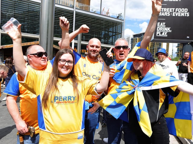 Mansfield Town fans soak up the Wembley atmosphere.