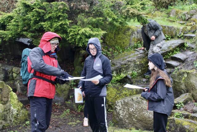Two Counties students outdoors finding orienteering clues