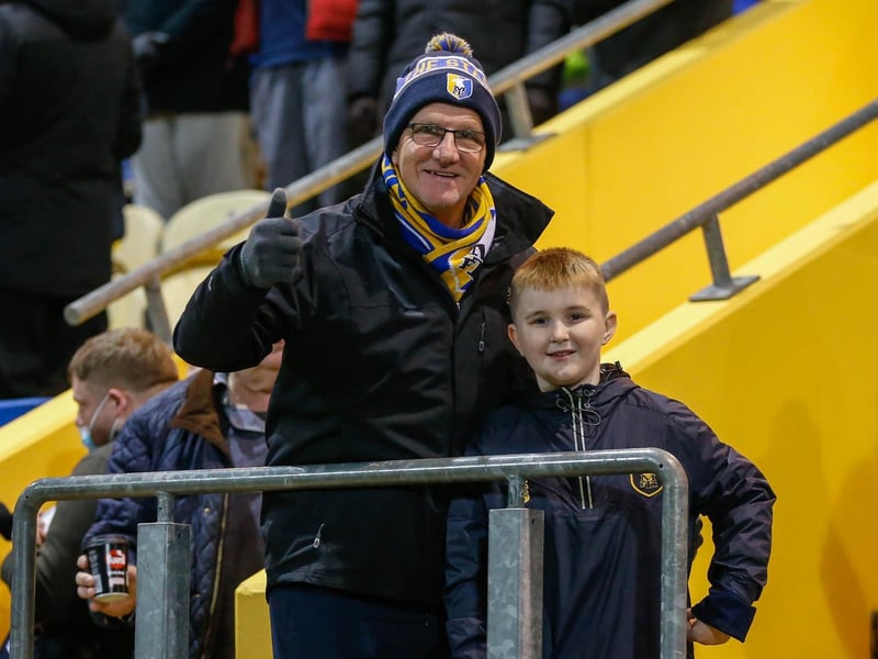 Mansfield Town's faces in the crowd against Swindon Town.