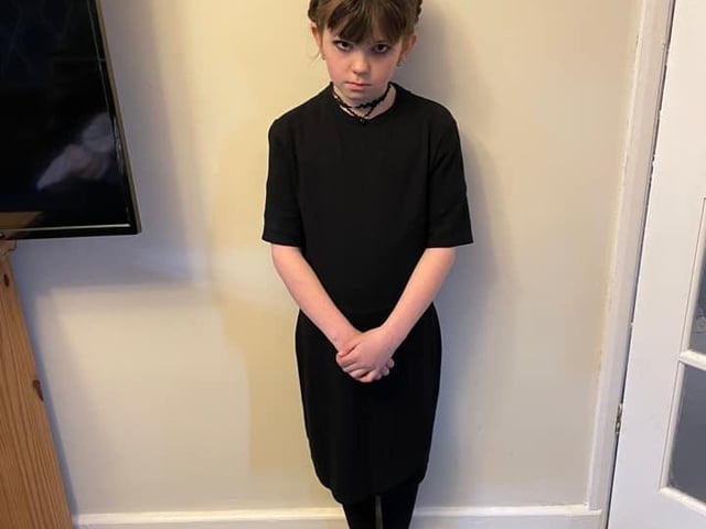 Katelyn aged eight as Wednesday Addams.