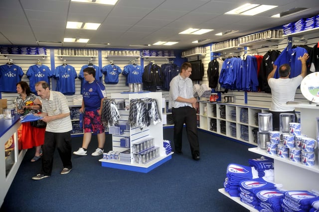 The club shop welcomes its first customers.