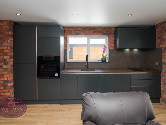 The annexe kitchen is fitted with modern units, quartz work surfaces and an 1810 sink, while integrated appliances include an oven, hob, fridge/freezer, dishwasher and washing machine,