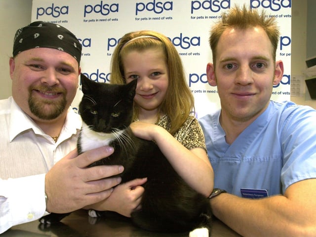 Marble the cat was returned to her owners after vet, Mike Squires, right removed an air gun pellet from her bladder in 2002, pictured with  7-year-old Alina Wall and dad Martin Wall from Barnsley  are pictured at the pet aid hospital on Newhall Rd, Newhall, Sheffield.