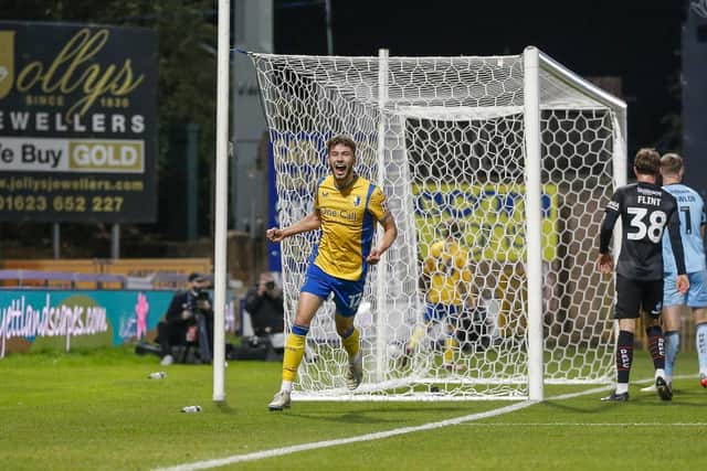 James Gale celebrates a goal in Mansfield Town's EFL Trophy win against Doncaster Rovers.