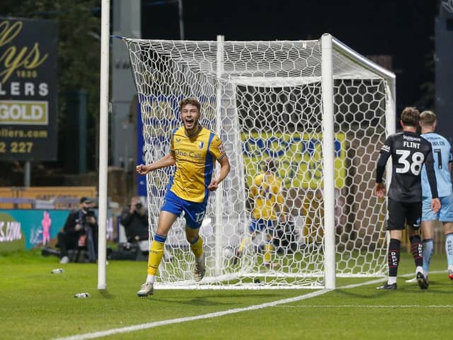 James Gale celebrates a goal in Mansfield Town's EFL Trophy win against Doncaster Rovers.