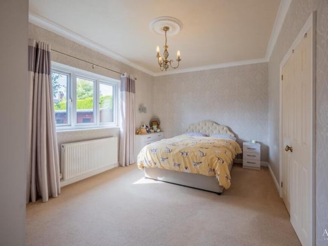 Moving on now to the bedrooms at the £475,000-plus bungalow, starting with the master, which is particularly impressive. On the other side of the large doors to the right is an en suite bathroom.