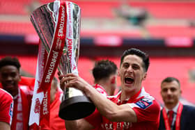 George Williams of Barnsley celebrates with the trophy following his side's victory  during the Johnstone's Paint Trophy Final between Oxford United and Barnsley at Wembley Stadium on April 3, 2016 in London, England.  (Photo by Dan Mullan/Getty Images)