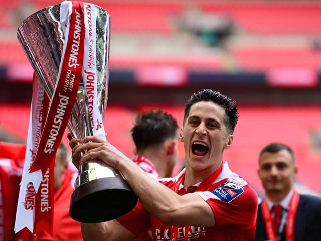 George Williams of Barnsley celebrates with the trophy following his side's victory  during the Johnstone's Paint Trophy Final between Oxford United and Barnsley at Wembley Stadium on April 3, 2016 in London, England.  (Photo by Dan Mullan/Getty Images)