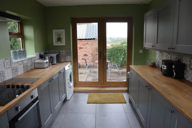The kitchen is modern and has integrated appliances.