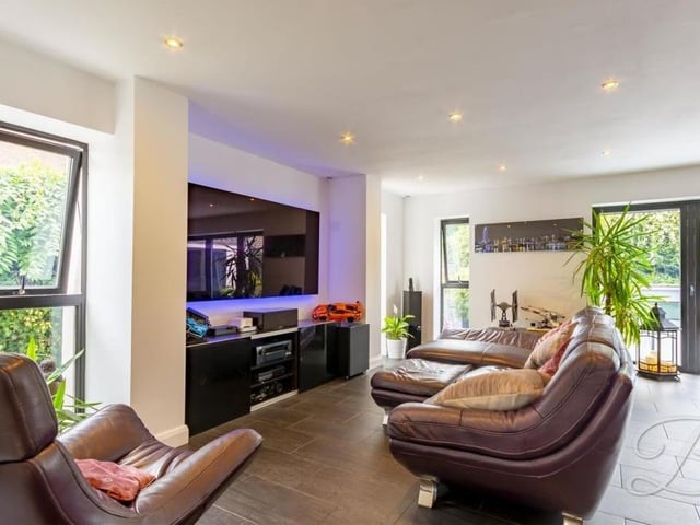 The open-plan ground floor also features this smart living area. Sit back and relax in front of the big screen.