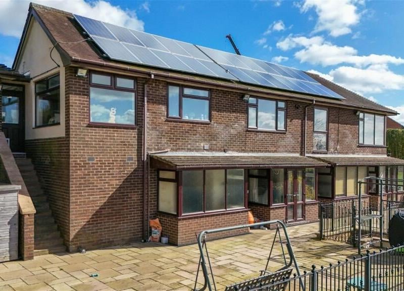 Time to step outside now and a return to the rear of the £799,995 property. Note the solar panels on the roof and also a large, raised paved patio that looks out over the garden.