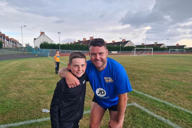 Emmerdale star Danny Miller with his assistant manager for the day, Archie Storer