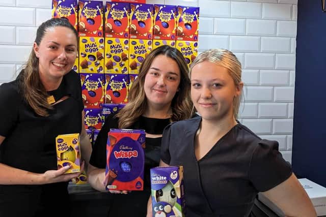 Alanya Jennings (left), manager of the Wood's Of Westgate hair salon in Mansfield, shows the Easter eggs already collected, with staff member Beth McLane (centre) and work-experience girl, Lexi Booth.