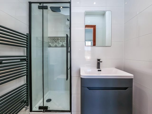 The en suite shower room to the third bedroom on the first floor has been recently decorated -- and what an eyecatching result!