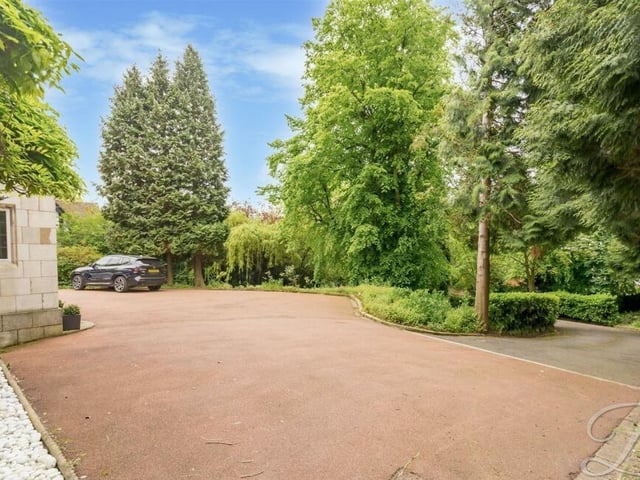 Gated access to the property takes you on to a sweeping driveway that leads to this extensive off-street parking area.