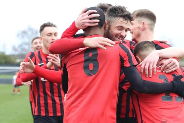 Title-chasing Shirebrook celebrate a goal at Dronfield.