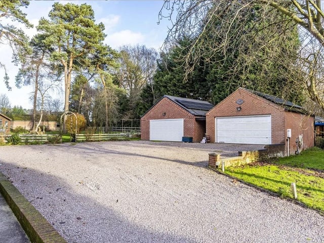 A selection of substantial outbuildings include two double garages, a range of useful stores and sheds, and an impressive barn, which previously benefited from planning permission for conversion into a two-bedroom residential dwelling