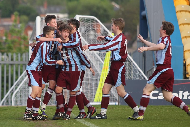 Liam Beardsley is mobbed by his team mates after scoring for Underwood Villa.
