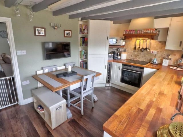 A last look at the excellent dining kitchen. It includes wood-block worktops and a Belfast sink with drainer and tiled splashback.