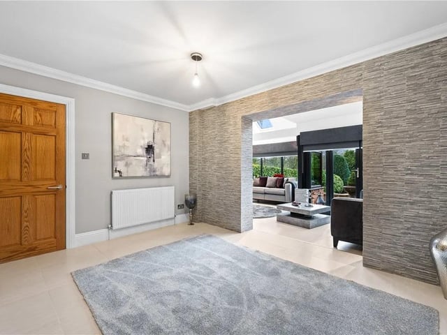 The property boasts a spacious and sleek dining room, the perfect place for entertaining or family meals