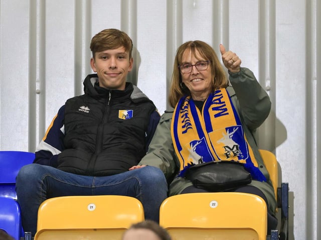 Travelling Mansfield Town fans during the Sky Bet League One match against AFC Wimbledon at Stadium Plough Lane.