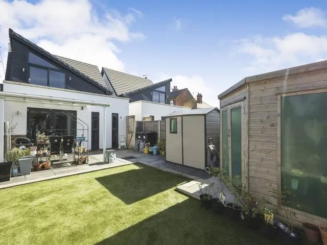 The view from the back of the Percy Street property is as visually impressive as the front. A landscaped garden includes an artificial lawn and summerhouse.