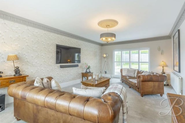 We open our tour of the £375,000-plus bungalow in the bright and spacious lounge or living room, which has windows to both the front and rear of the property, allowing natural light to flood through.