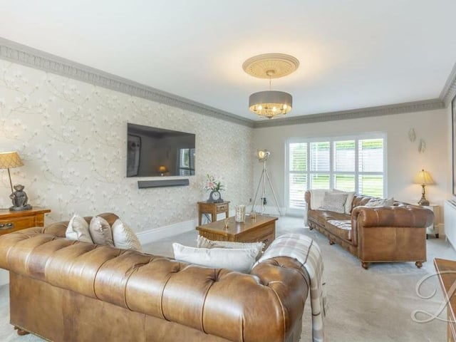 We open our tour of the £375,000-plus bungalow in the bright and spacious lounge or living room, which has windows to both the front and rear of the property, allowing natural light to flood through.