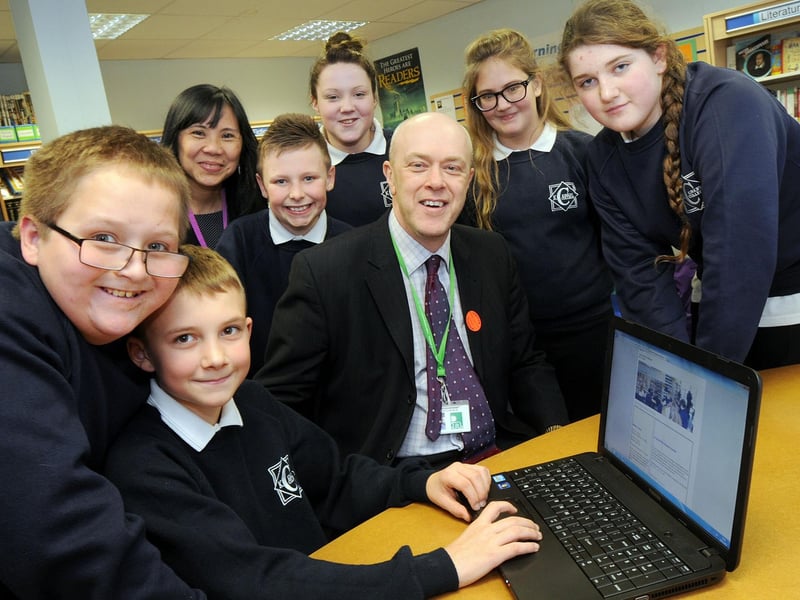 Year 7 pupils from Kirkby College pictured with Coun. John Knight, leader of Ashfield District Council and Jo Carroll, in their school library which is to benefit from laptop computers. The picture was taken in 2013.