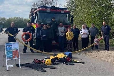 Firefighters and visitors with some of the equipment demonstrated.
